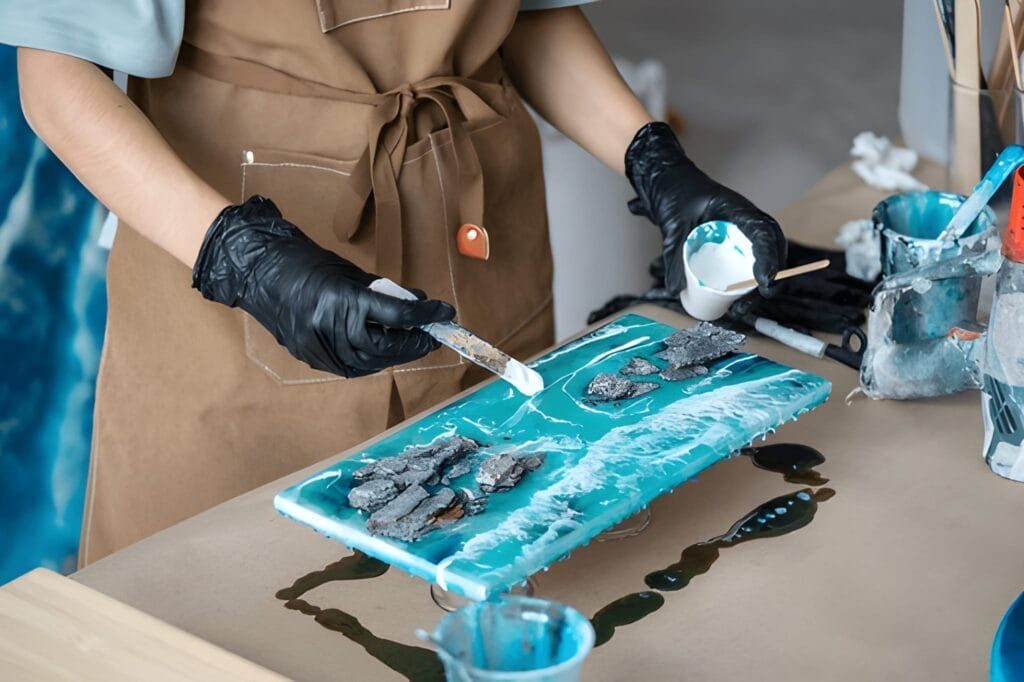 A-close-up-action-shot-of-an-artist-in-gloves-slowly-pouring-colored-resin-into-a-silicone-coaster-mold-showing-the-vibrant-swirl-of-colors-1024x682 How to Use Epoxy Resin for Beginners: A Flawless Guide