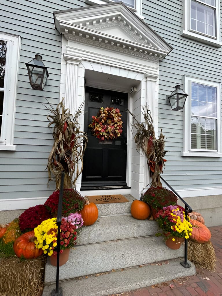 beautifully-decorated-front-porch-with-pumpkins-mums-and-a-fall-wreath-768x1024 Cozy Fall Decor Ideas for a Warm & Inviting Space